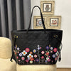 Louis Vuitton
LV x TM Neverfull MM 
31 x 28 x 14 cm