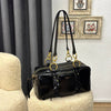Prada Dangle medium leather top-handle bag 
30 x 14 x 13.5 cm