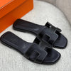 Black hermes slipper